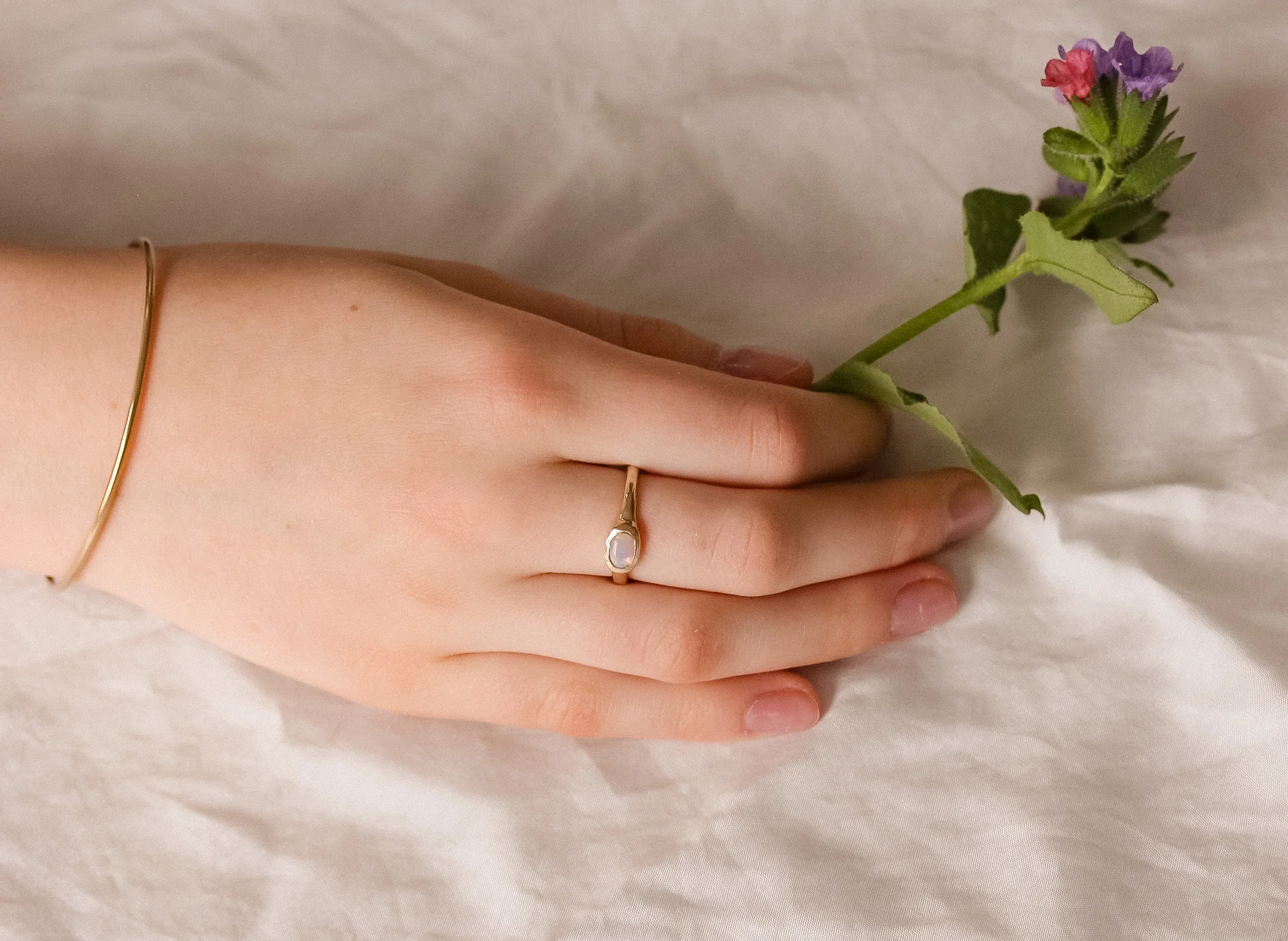 The Reverie Oval: A 14k Gold Hand-Carved Opal Ring - Mitchell's Manufacturing Jewel